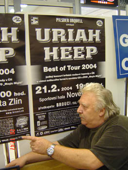 Lee looking and pointing at our poster