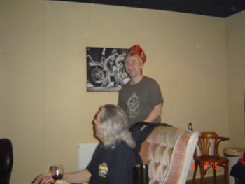 Rolf sneaking up on Phil with a 6 pack carton on his head